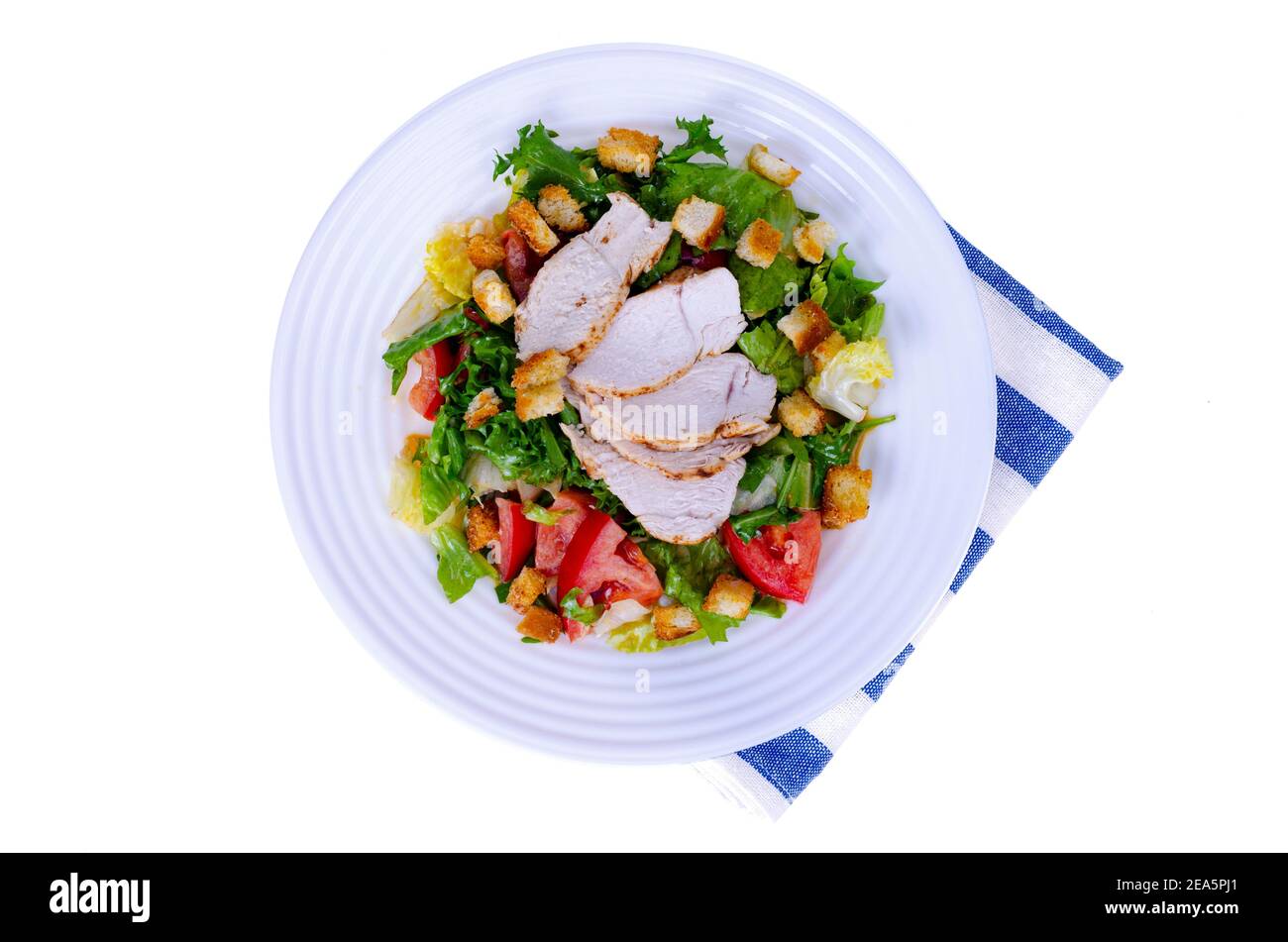 Home kitchen. Vegetable salad with chicken and croutons. Caesar Stock Photo Alamy