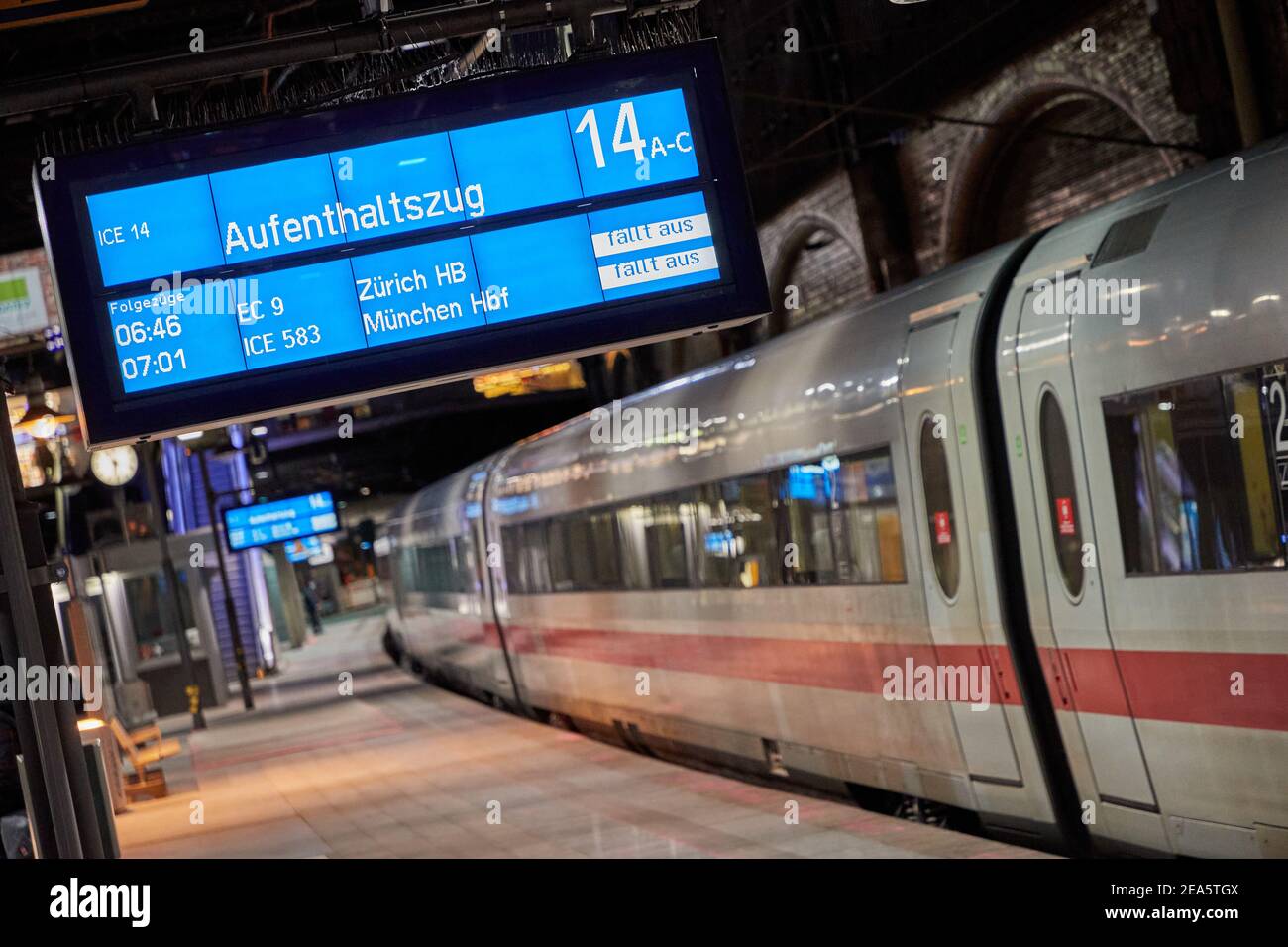 Hamburg, Germany. 08th Feb, 2021. A display board hangs above a platform in  Hamburg's main train station with notices about a "stalling train" and train  cancellations for connections to Zurich and Munich.