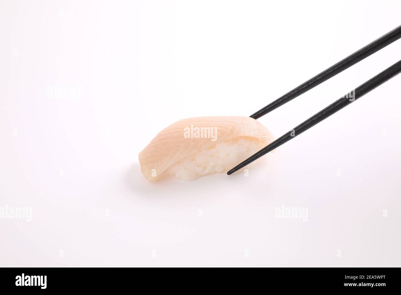 Hamachi sushi , Japanese food yellowtail sushi with chopsticks isolated