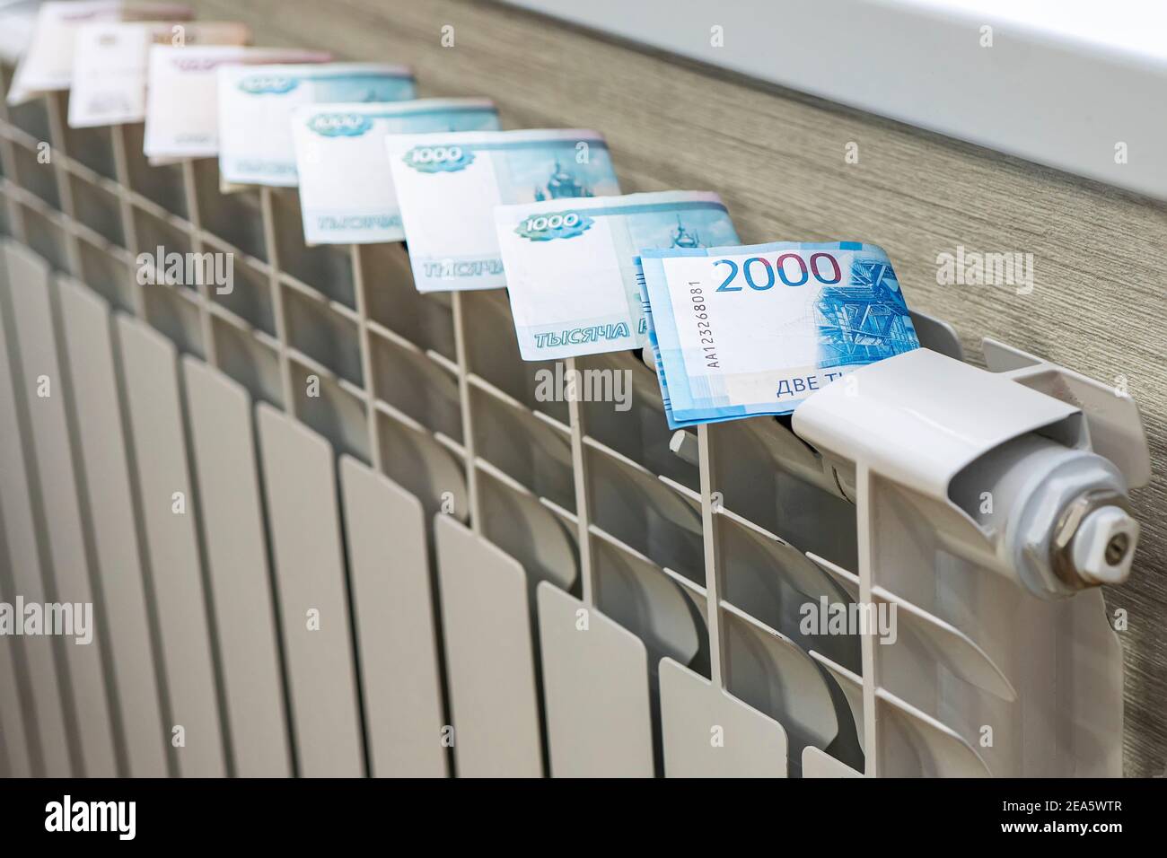 Closeup dollar bills on radiator. concept of paying for heating in ...