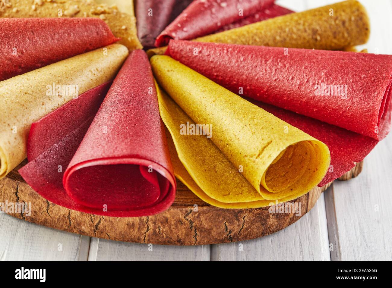 Sweet pure fruit pastille in rolls. Healthy sweets lozenges, fruit