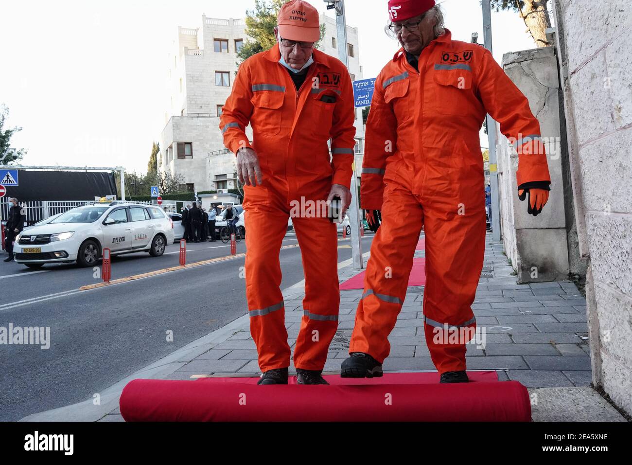 Jerusalem, Israel. 8th Feb, 2021. Crime Minister anti Netanyahu activists lay a red carpet and conduct a mock cleanup operation to ‘clean up corruption' and demand PM's resignation at the Prime Minister's Residence in Jerusalem. Netanyahu's trial begins later today with a hearing he is required to attend at the Jerusalem District Court focusing on his response to the criminal indictment against him. Israel's first serving prime minister to go on criminal trial faces charges of bribery, fraud and breach of trust ahead of 23rd March, 2021 elections. Credit: Nir Alon/Alamy Live News Stock Photo