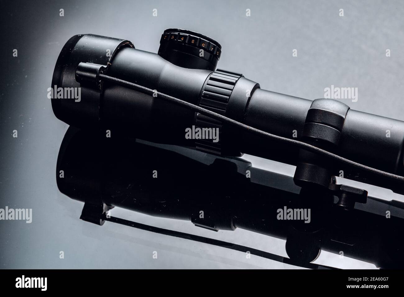 Black rifle optical sight on black background Stock Photo