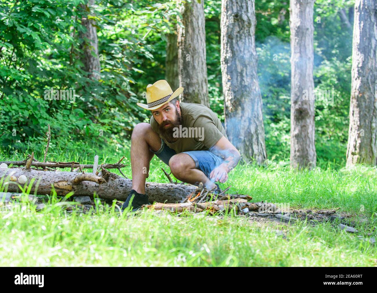 How to build bonfire outdoors. Arrange the woods twigs or wood sticks