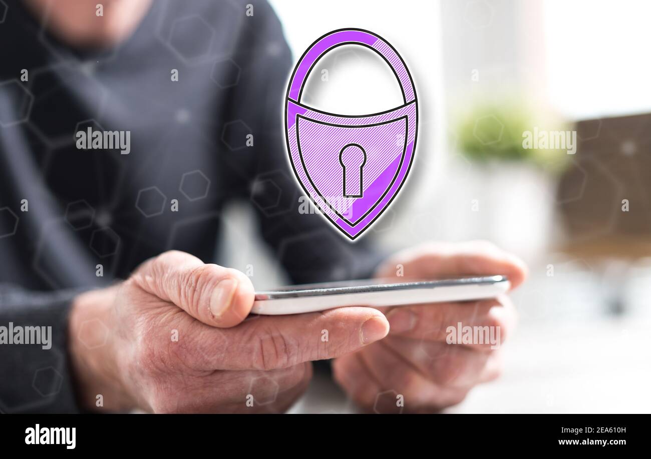 Hands of man holding a smartphone with cyber security concept Stock ...