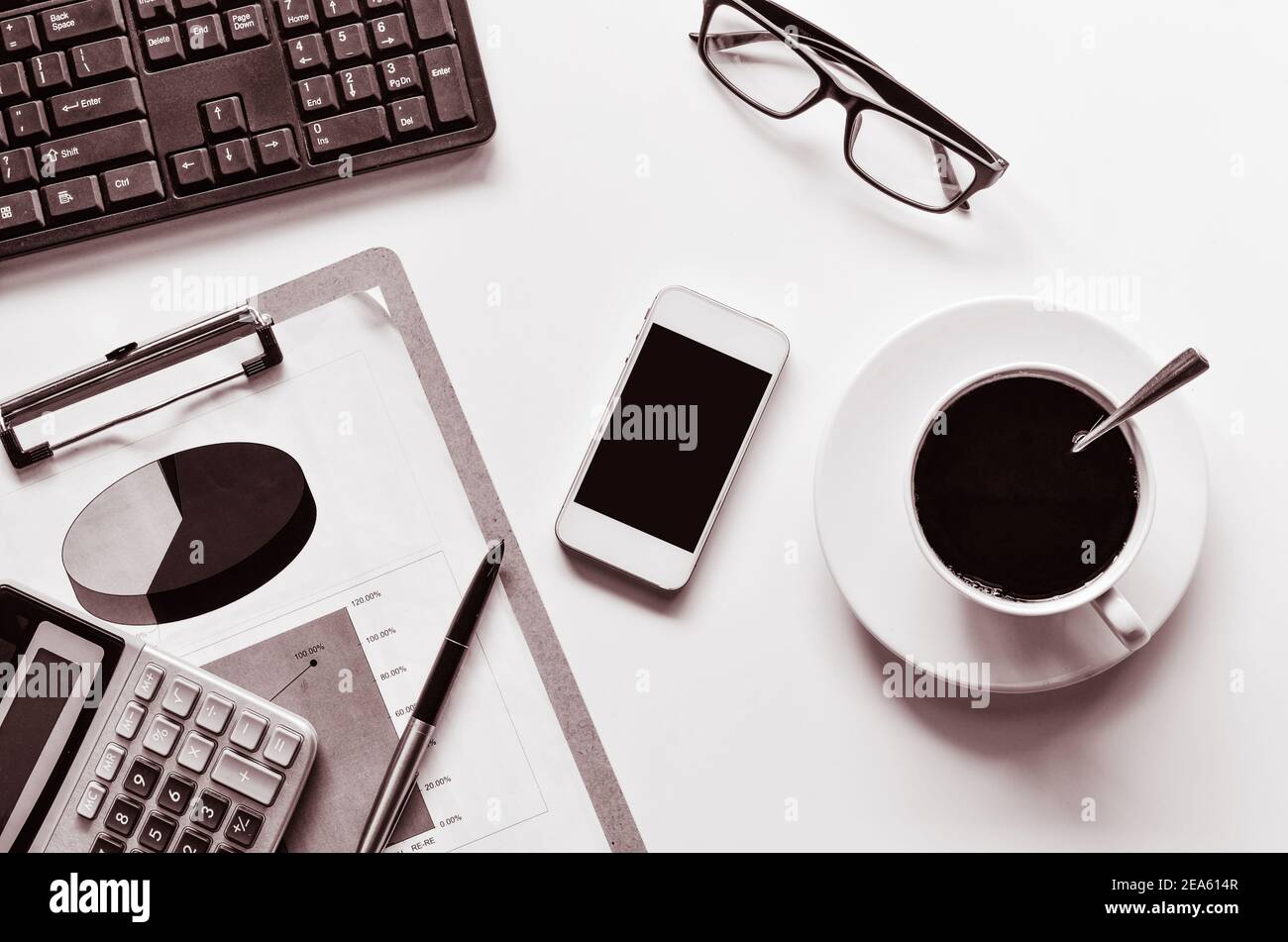 Data Graphing Calculator, pen, glasses and a cup of coffee - tone black and white Stock Photo