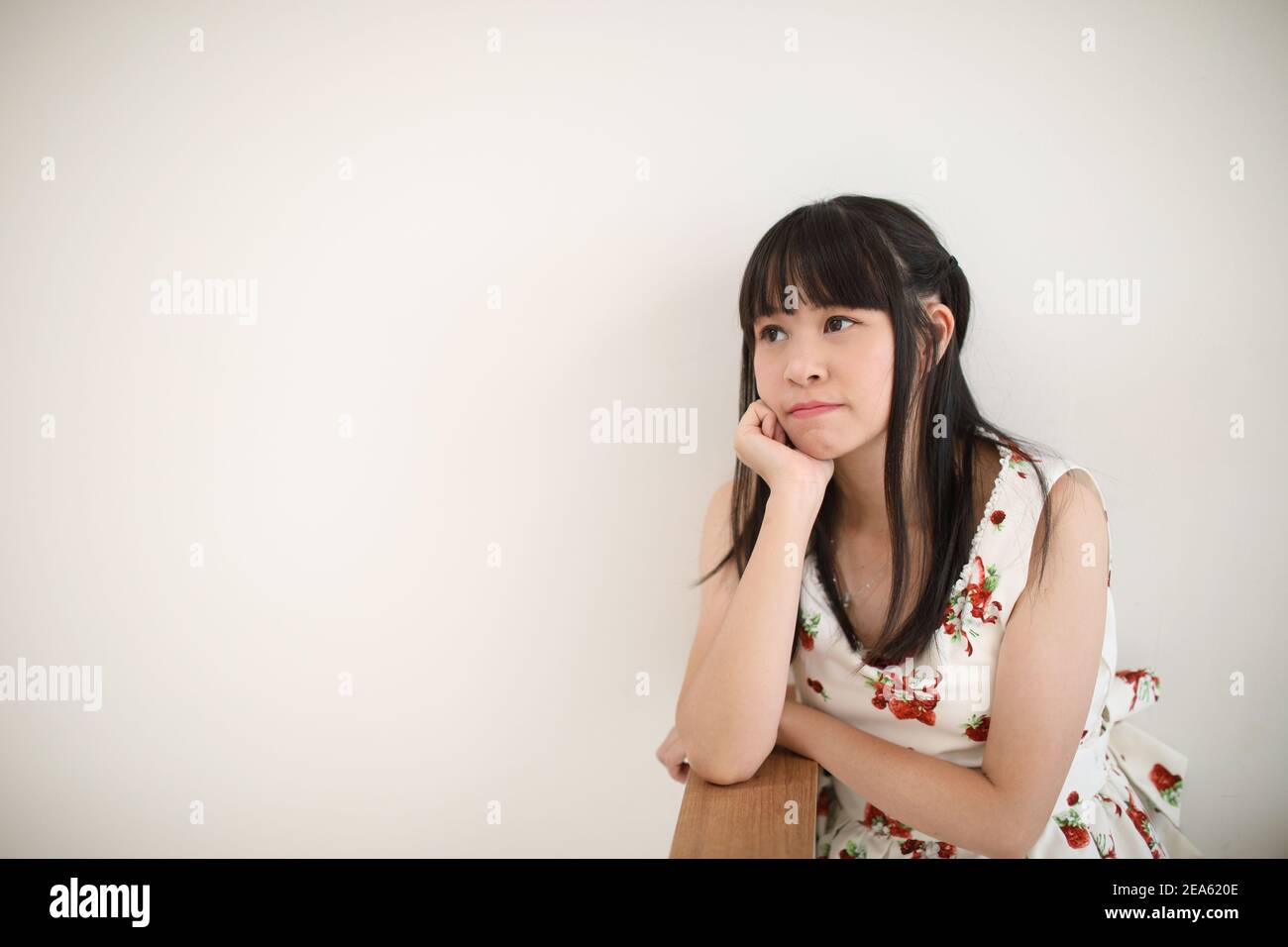 Portrait young woman thinking and looking modern style in outdoor urban ...