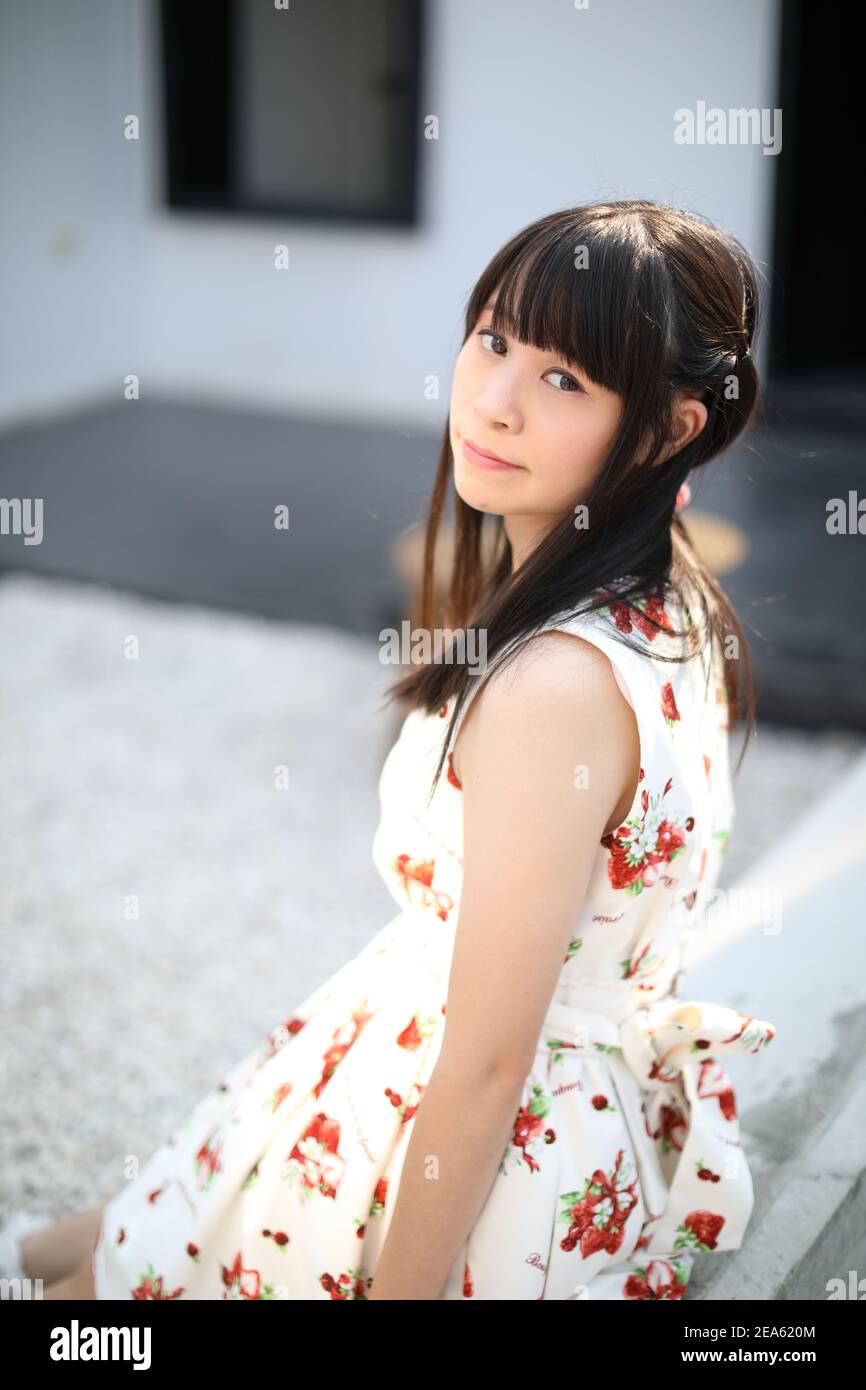 Portrait young woman thinking and looking modern style in outdoor urban ...