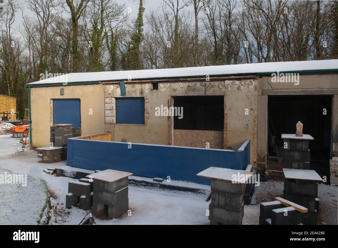 Winter Snow Covering the Building Site of a Cottage Renovation in Rural Devon, England, UK Stock Photo