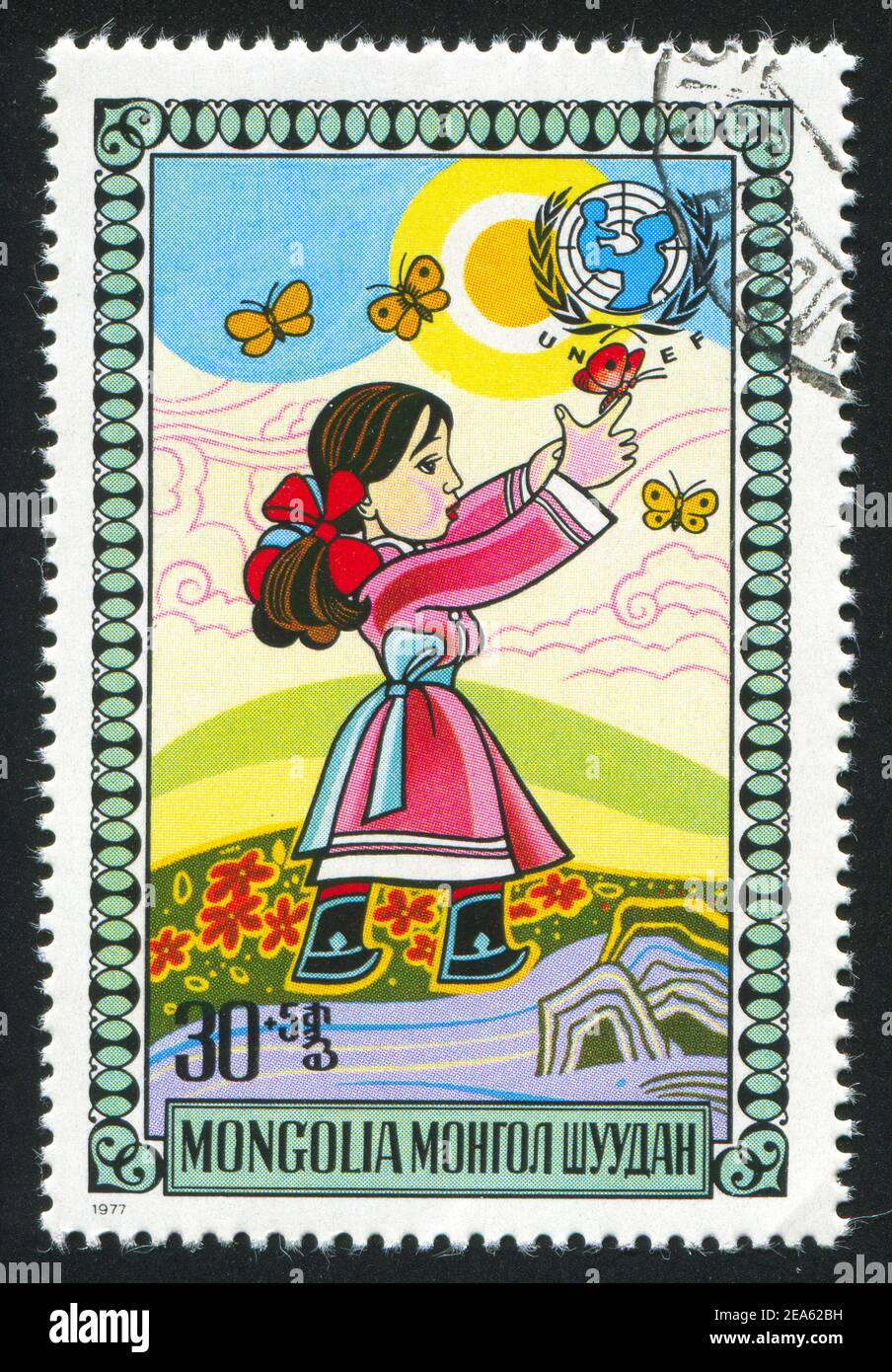 MONGOLIA - CIRCA 1977: stamp printed by Mongolia, Girl chasing butterflies, circa 1977 Stock Photo