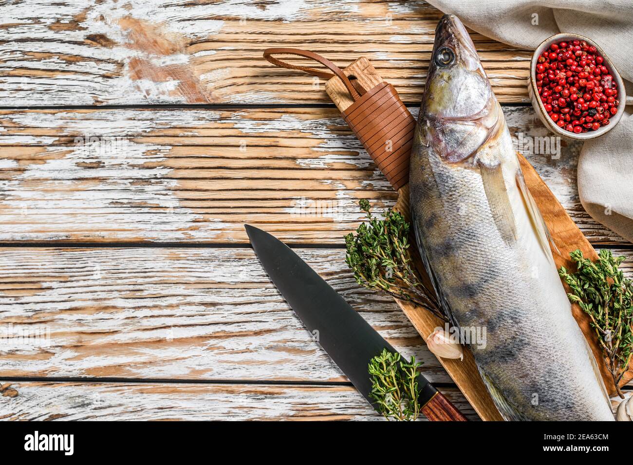 Raw pike perch, pikeperch fish on a cutting board. Fresh fish. White  background. Top view. Copy space Stock Photo - Alamy