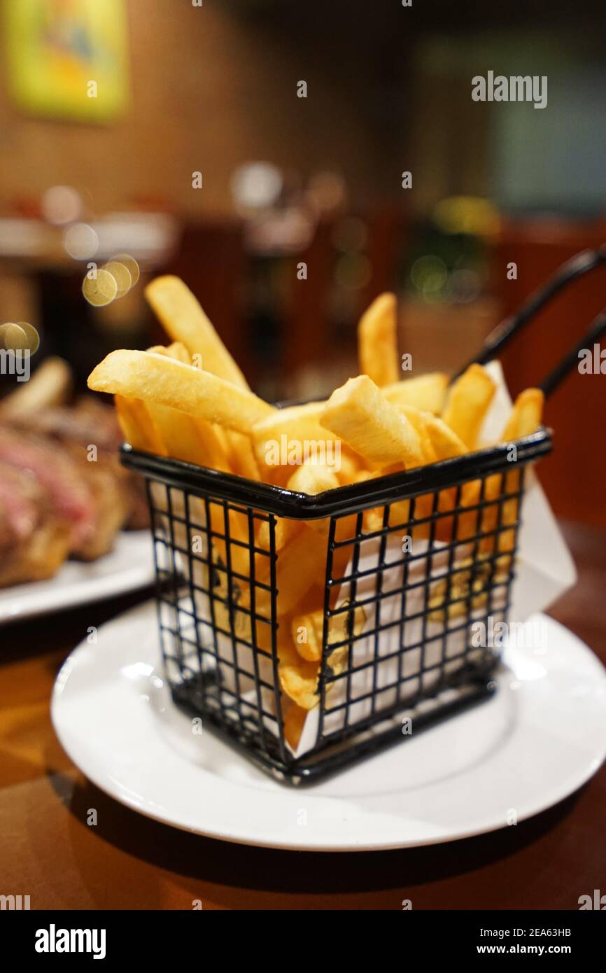 Basket of deep fried French potato fries Stock Photo Alamy
