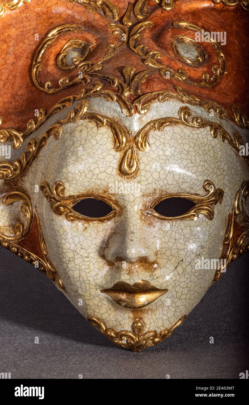 Traditional venetian carnival mask on grey background Stock Photo