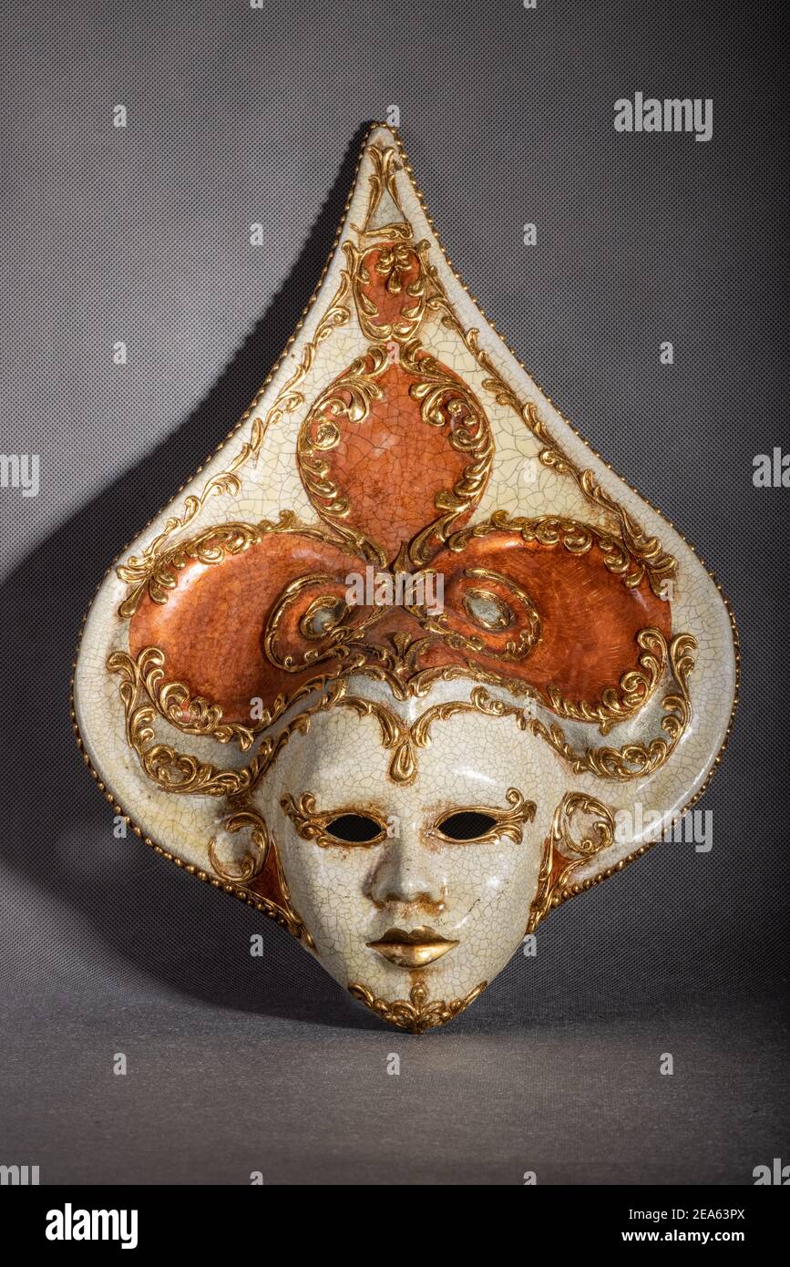 Traditional venetian carnival mask on grey background Stock Photo