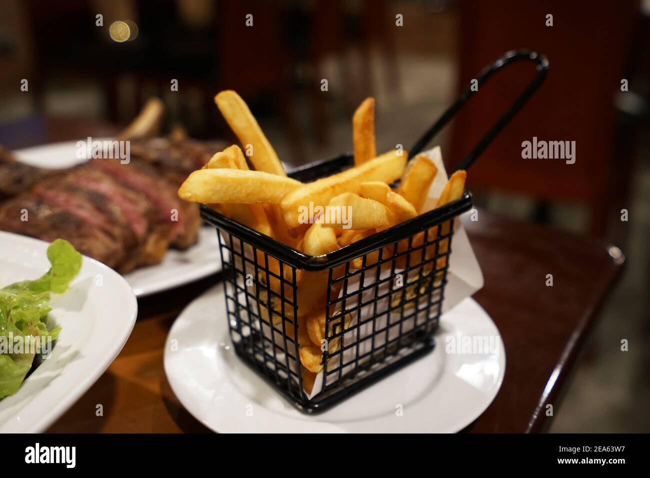 Basket of deep fried French potato fries Stock Photo Alamy