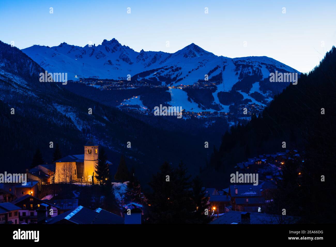 Evening panorama of Champagny-en-Vanoise over Courchevel valley and ski resort with Alps mountain peaks view from Stock Photo