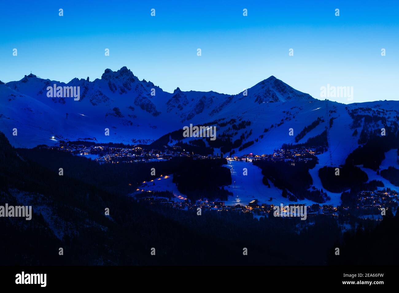 Evening panorama of Courchevel valley and ski resort with Alps mountain peaks view from Champagny-en-Vanoise Stock Photo