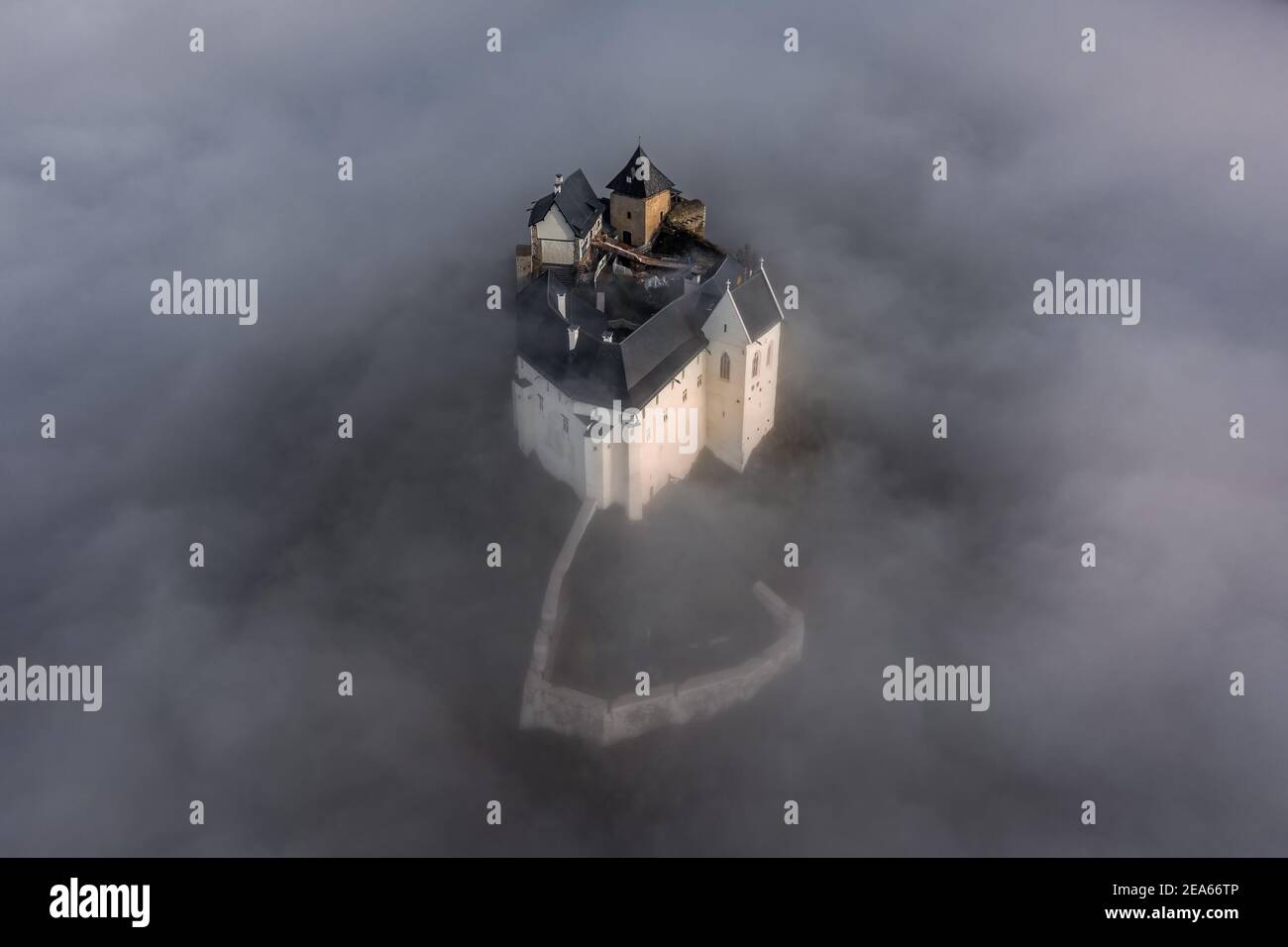 Fuzer, Hungary - Aerial view of the beautiful Castle of Fuzer standing out of the fog on an autumn morning. This castle has been located in the Zemple Stock Photo