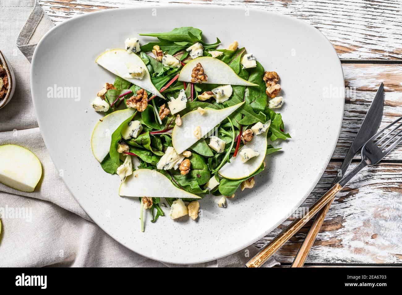 Salad with blue cheese, pears, nuts, chard and arugula. White