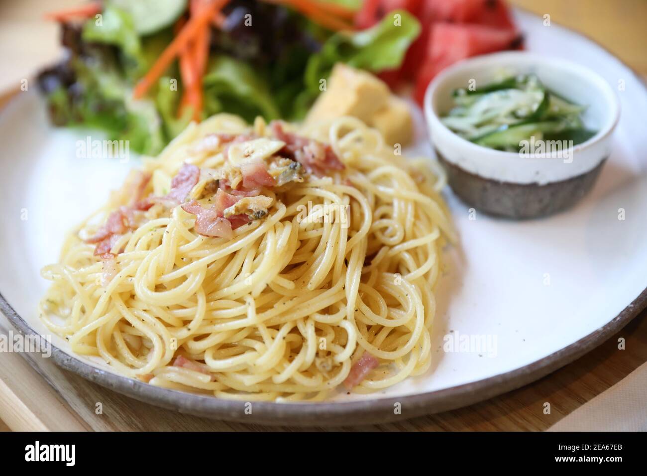 Spaghetti with mussels and ham in japanese style Stock Photo