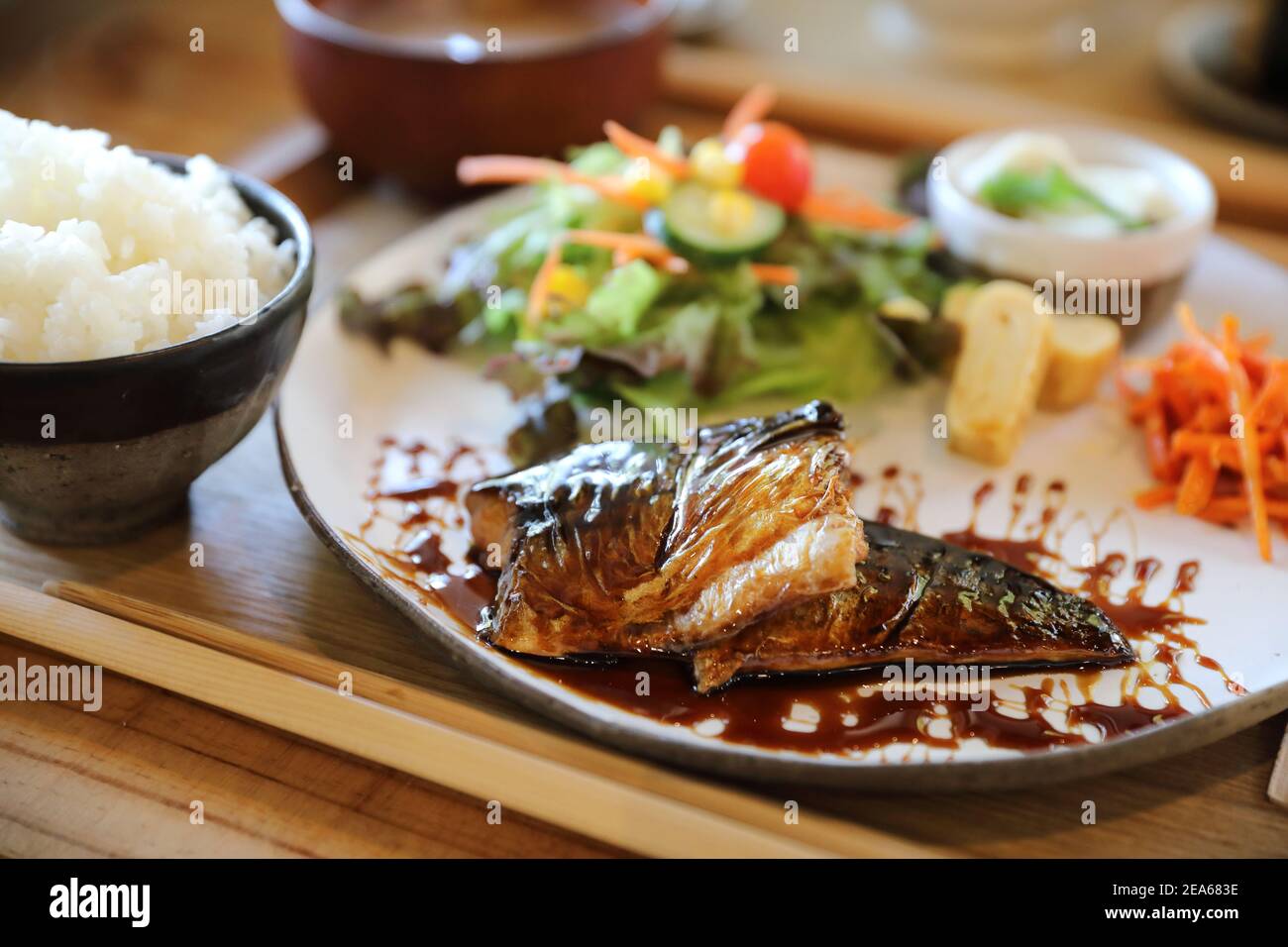Saba fish teriyaki with rice soup and salad on wood background , Japanese food Stock Photo