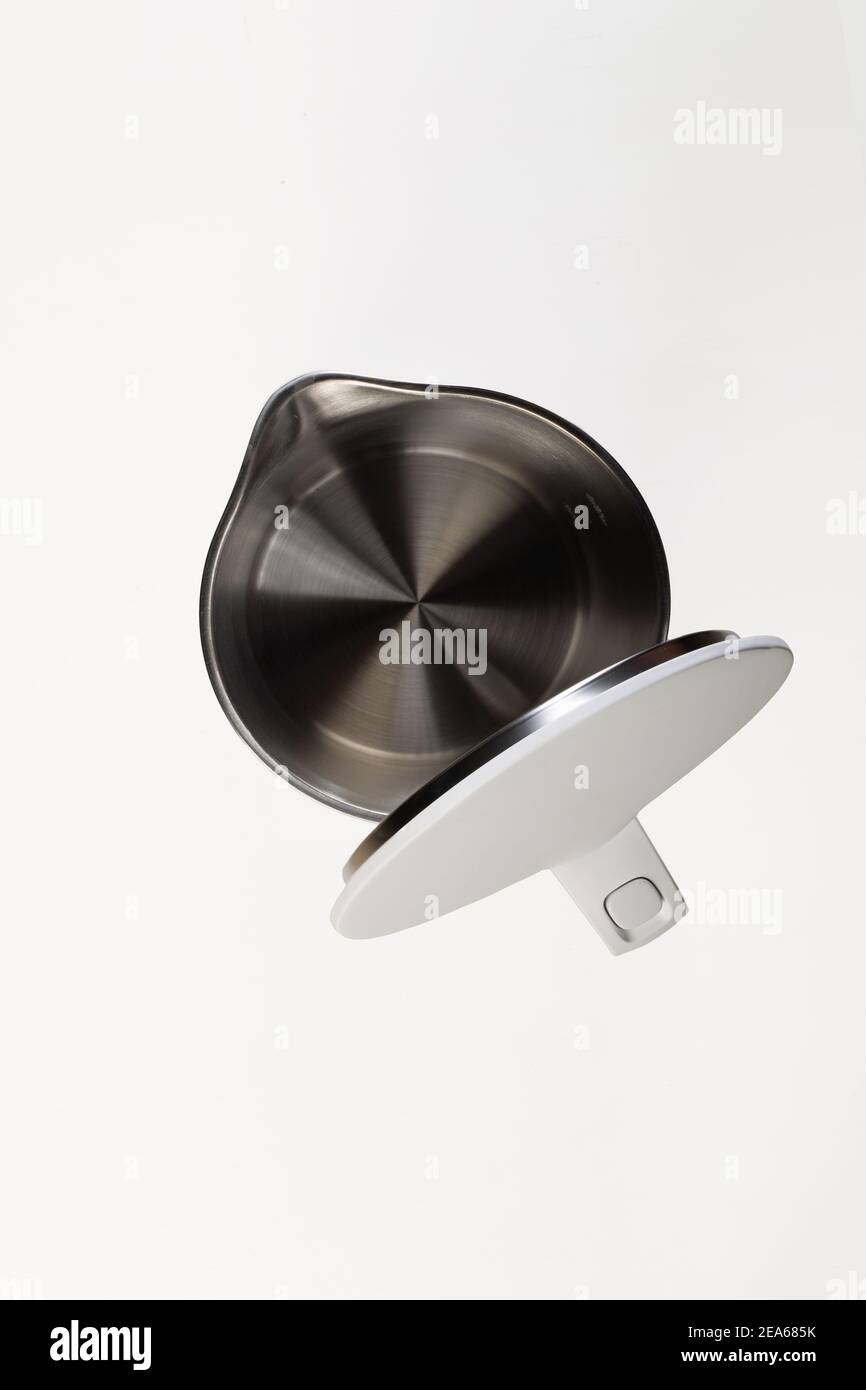 empty electric kettle with open lid with hidden metal heating element