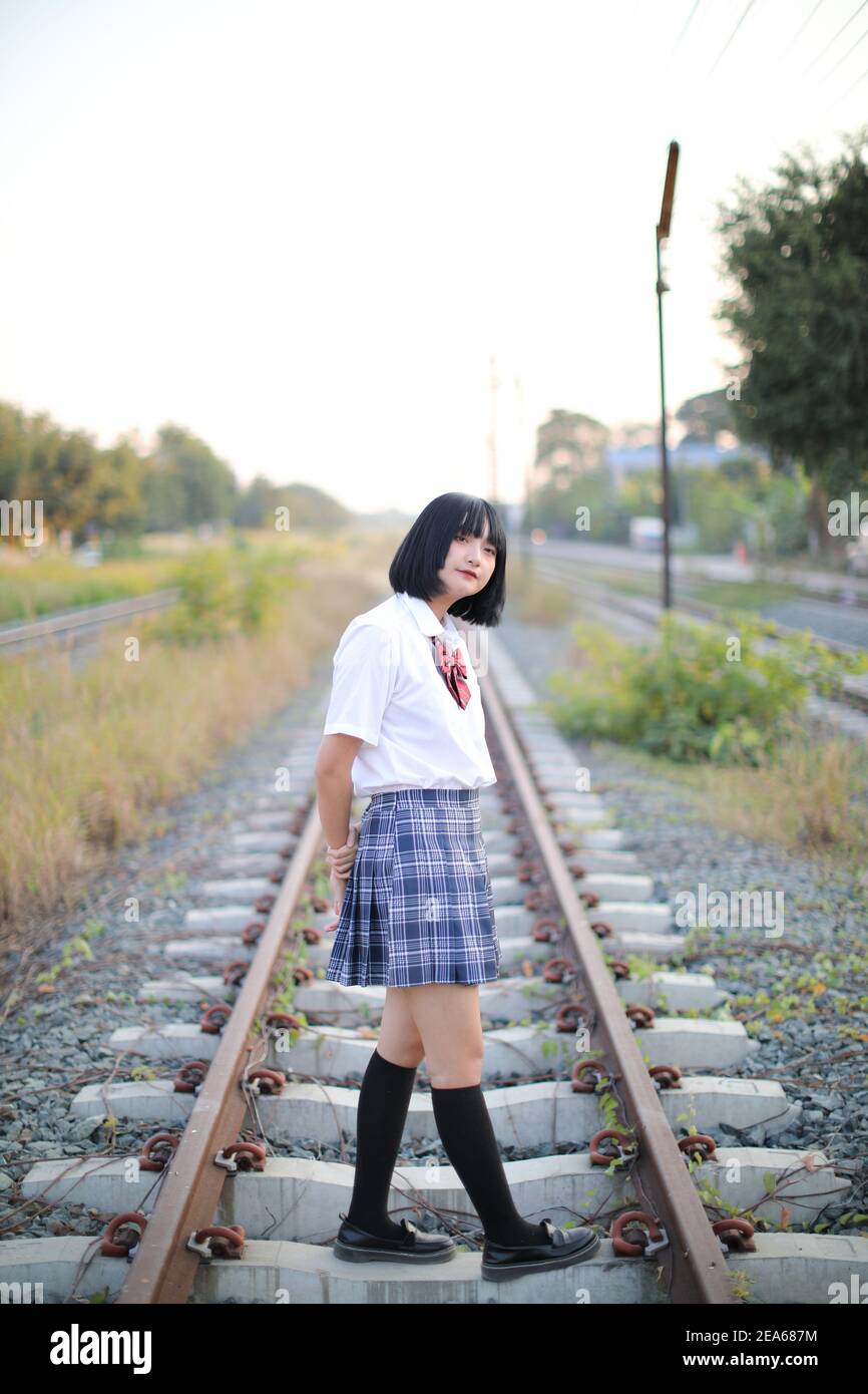 Asian school girl walking in urban city Stock Photo Alamy