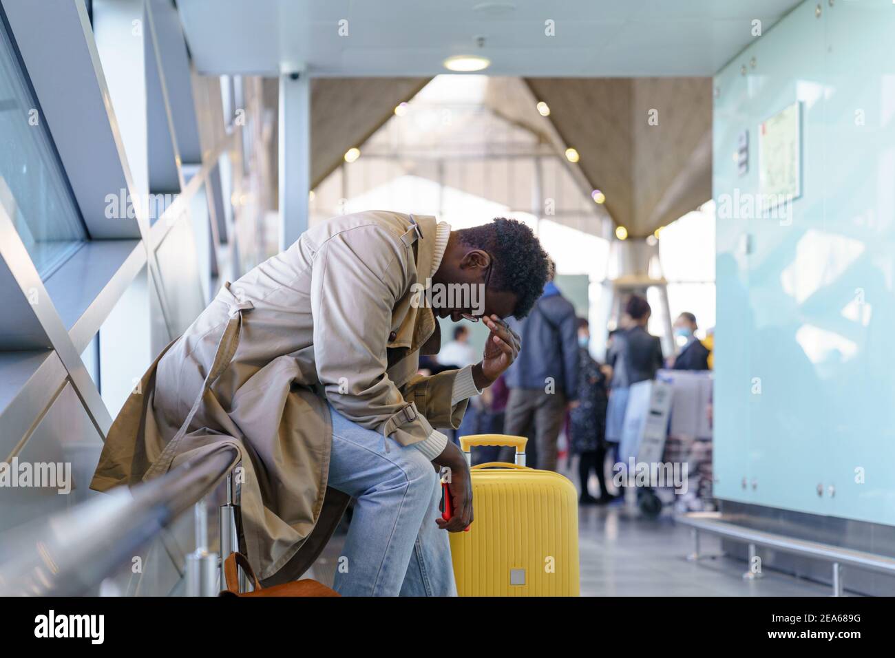 Black traveler man overslept his flight, missed the plane sitting in Black traveler man overslept his flight, missed the plane sitting in