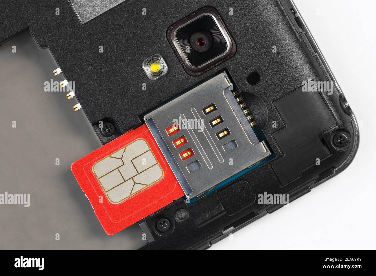 SIM card slot, sim card, camera and mobile phone light. Close-up. Stock Photo