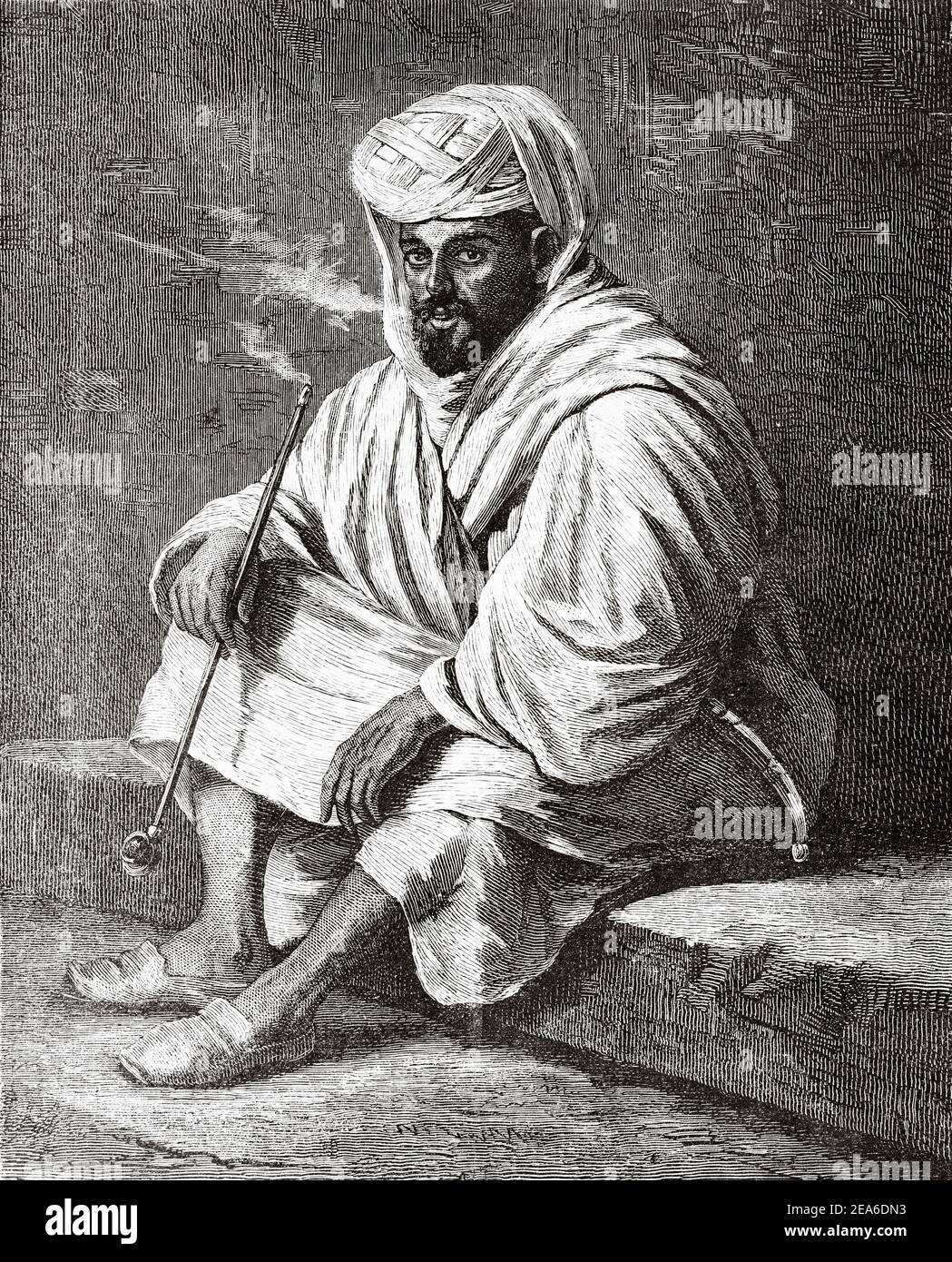 Tunisian pilgrim smoking a pipe and dressed in traditional Arab clothing, Tunisia, North Africa. Old 19th century engraved illustration from El Mundo Ilustrado 1879 Stock Photo