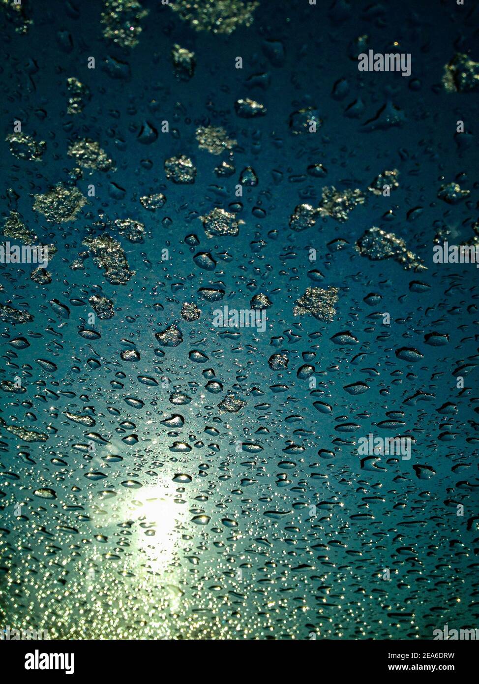 frosty natural pattern on winter window, drops and sun Stock Photo - Alamy