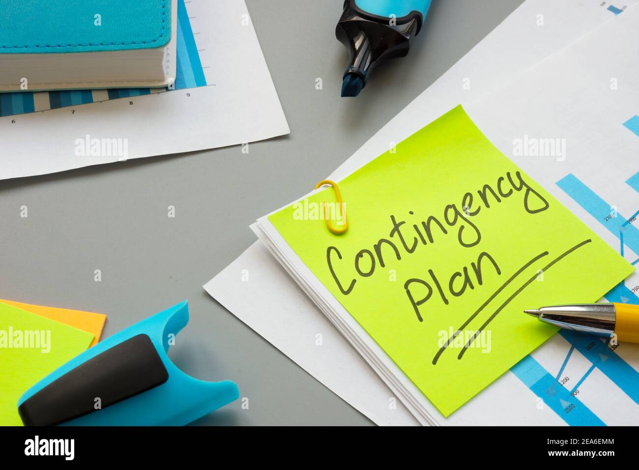 Business Contingency plan papers and notepad on the table. Stock Photo