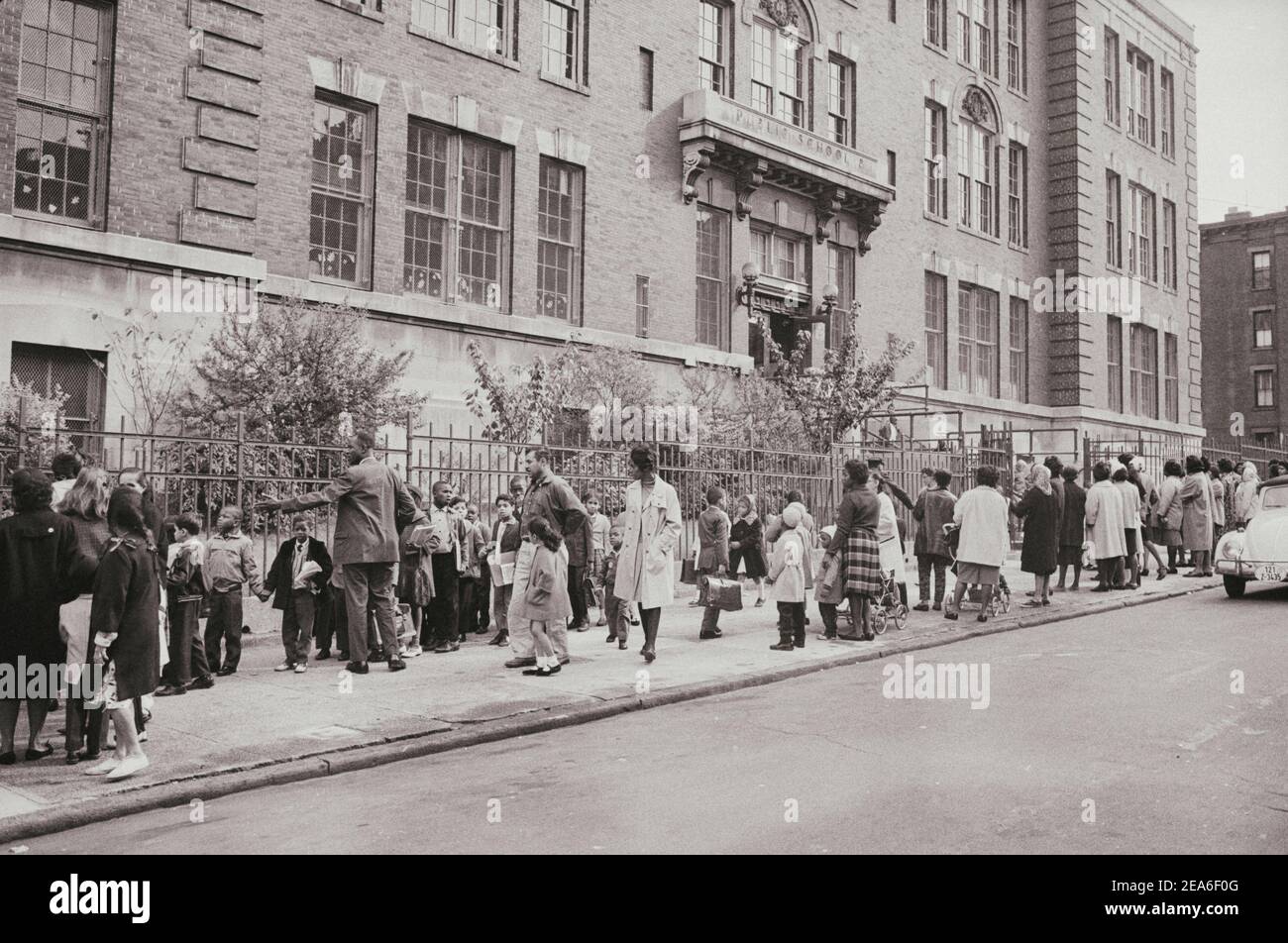 Vintage photo of New York public school. Parents meet their children after school. USA. October 1, 1964 Stock Photo
