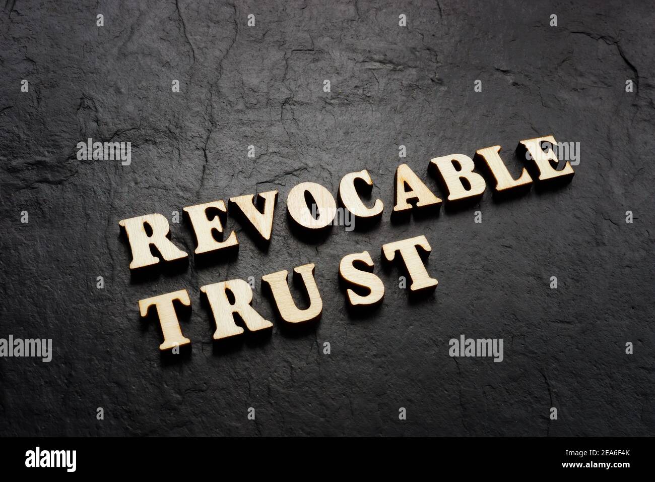 Revocable trust words on the dark background. Stock Photo