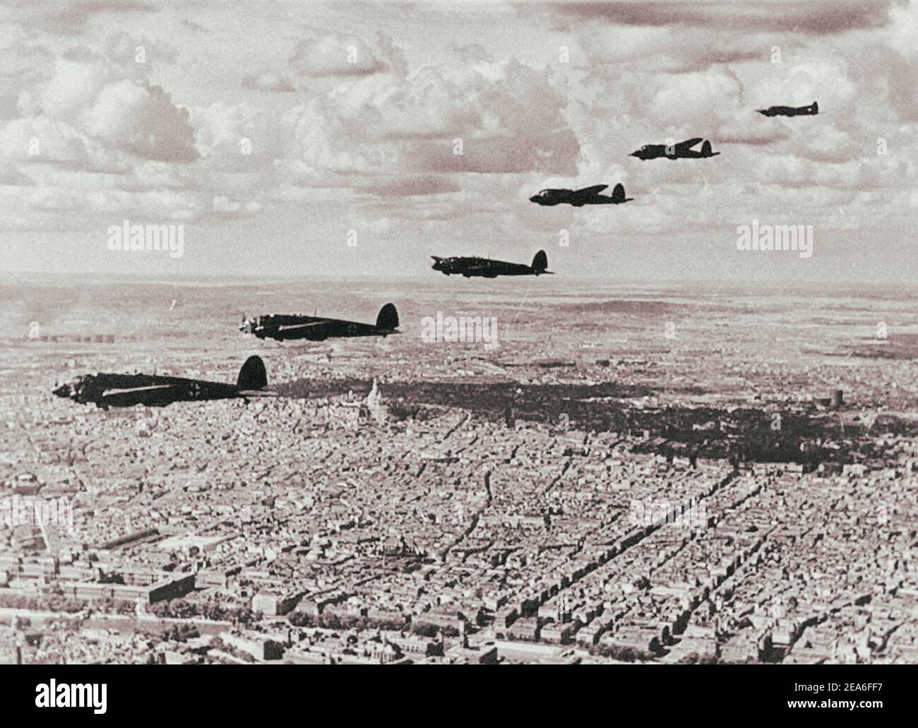 A squadron of German Heinkel He-111 two-engine bombers from the Nazi Luftwaffe in the sky over Paris. France. 1940 Stock Photo
