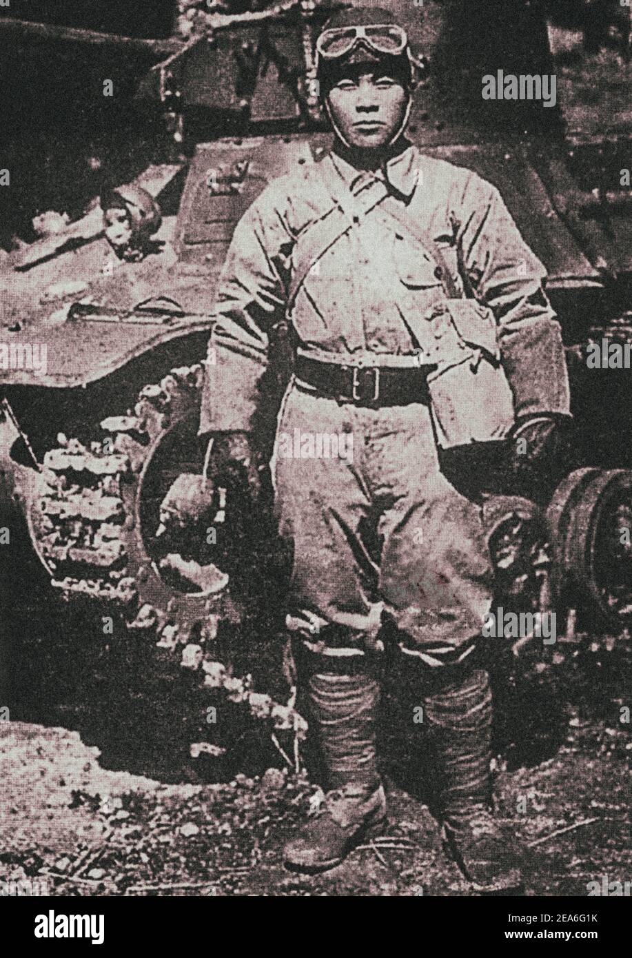 Japanese tanker posing against the background of his combat vehicle – Type 95 “Ha-Go” light tank. Type 95 is a Japanese light tank of the 1930s. Also Stock Photo