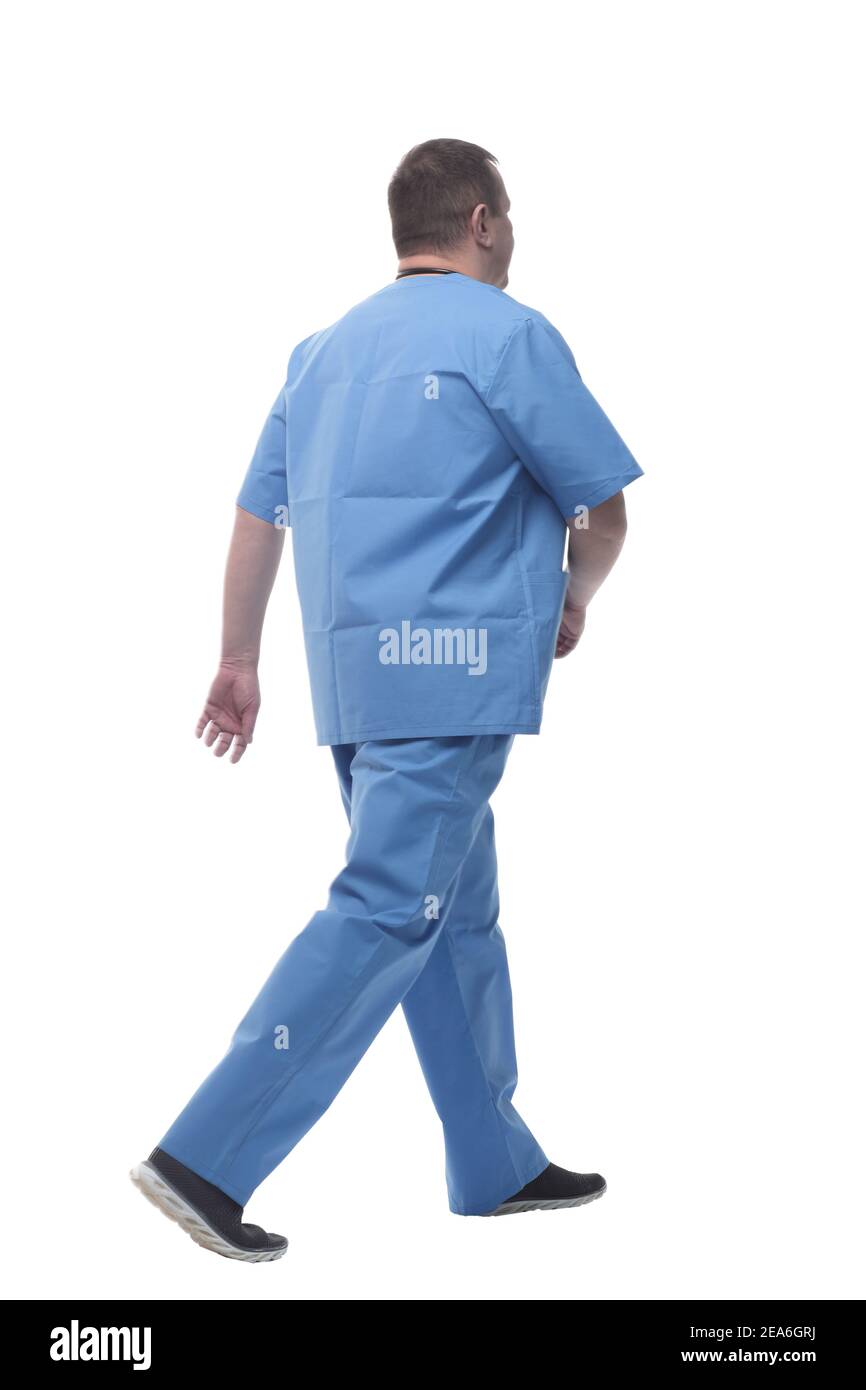 confident male doctor striding forward. isolated on a white background ...