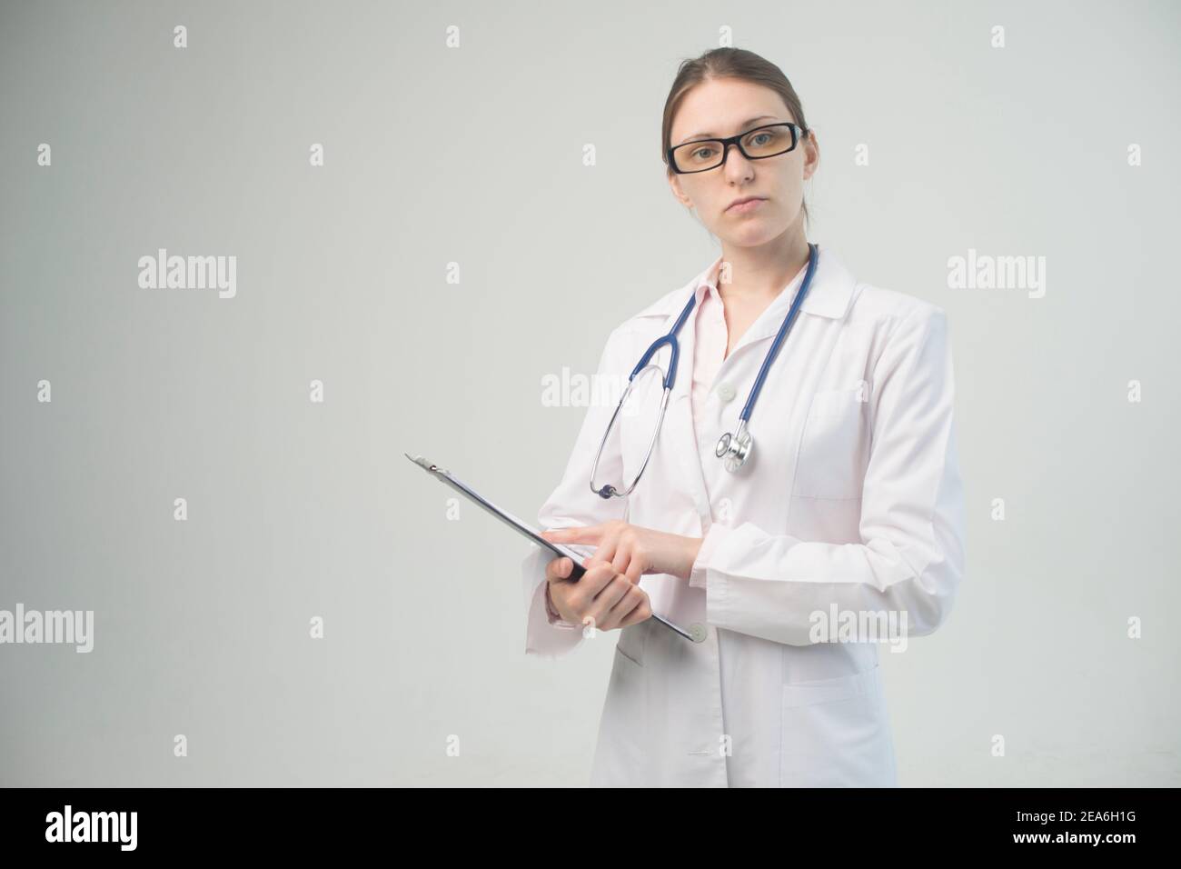Female doctor in white coat hi-res stock photography and images - Alamy