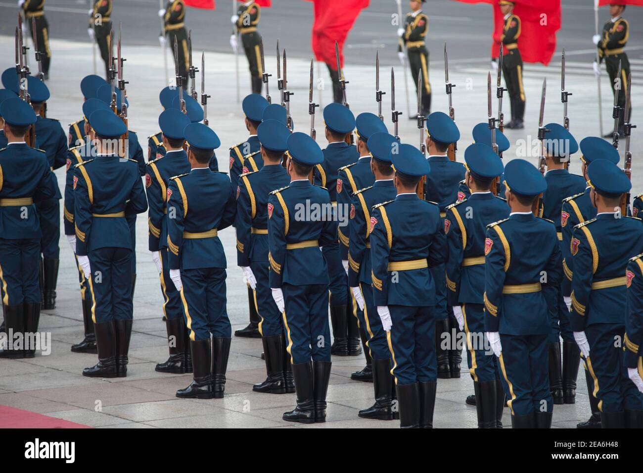 Chinese soldiers of the presidential honour guard holding rifles and weapons march in tight formation during a foreign dignity visit to the capital city of China, at the Great Hall of the People in Tiananmen Square in central Beijing © Time-Snaps Stock Photo