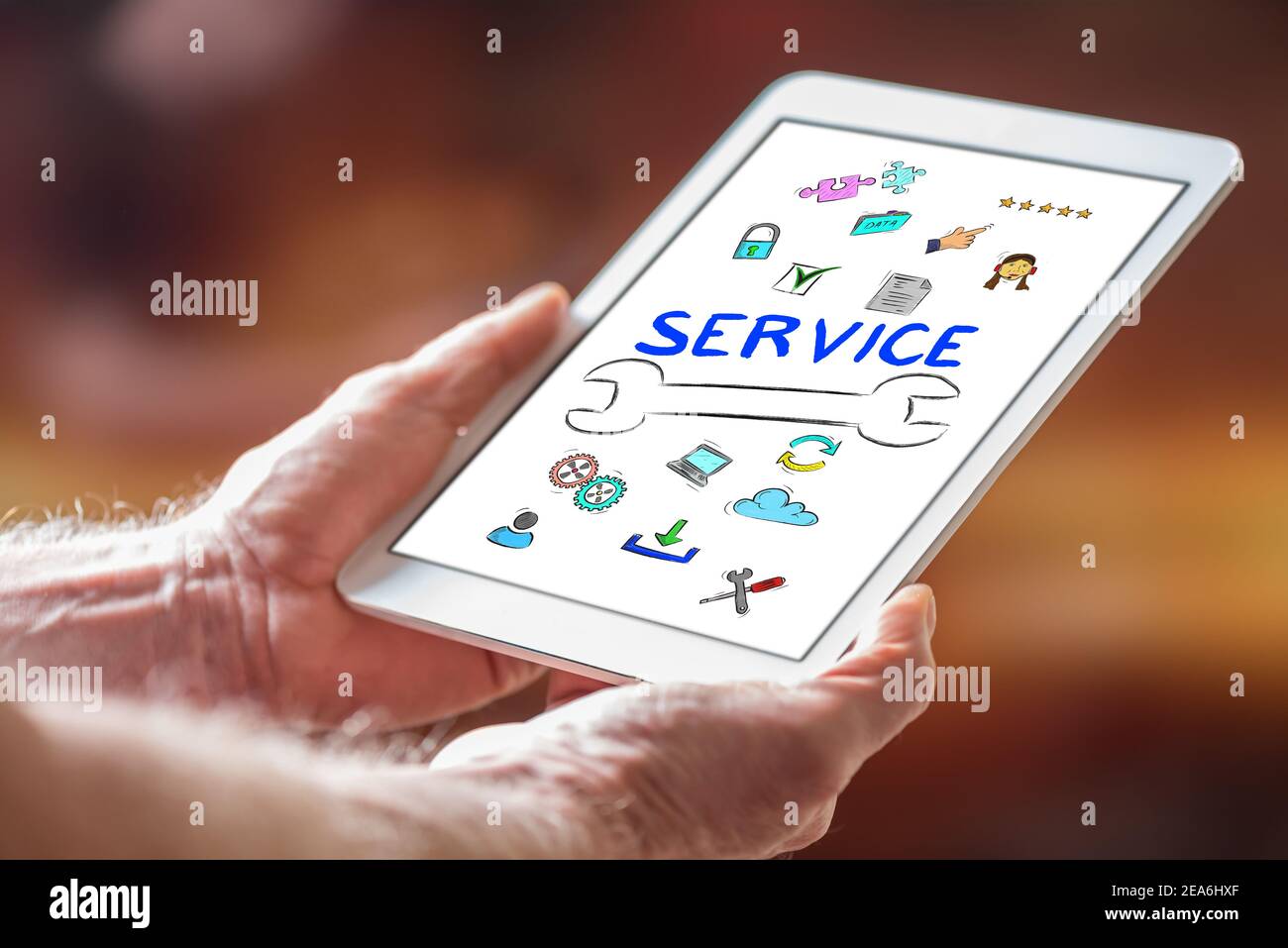 Customers Using Tablets Man holding a tablet showing customer service concept Stock Photo - Alamy