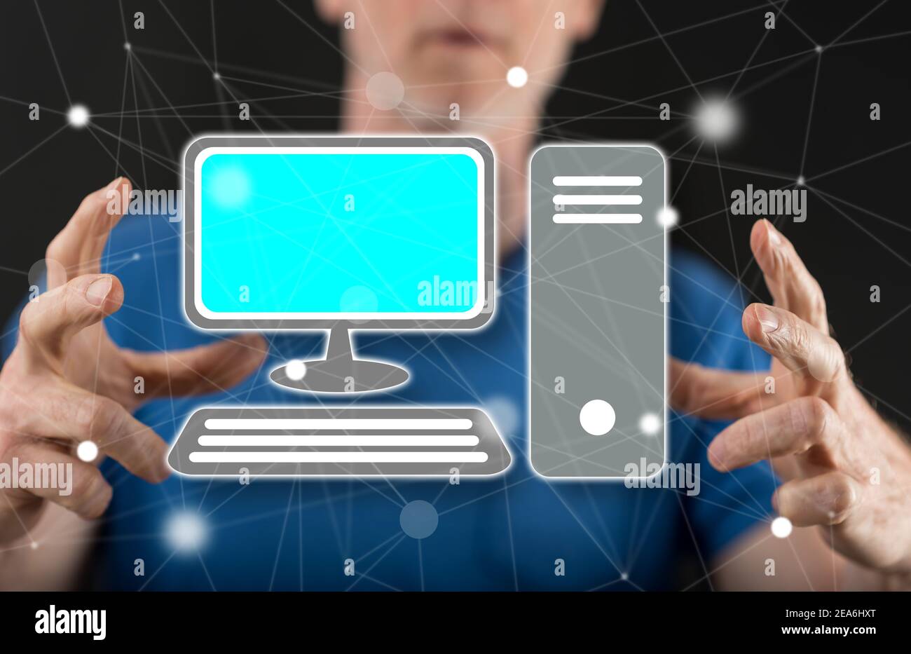 Computer concept between hands of a man in background Stock Photo - Alamy