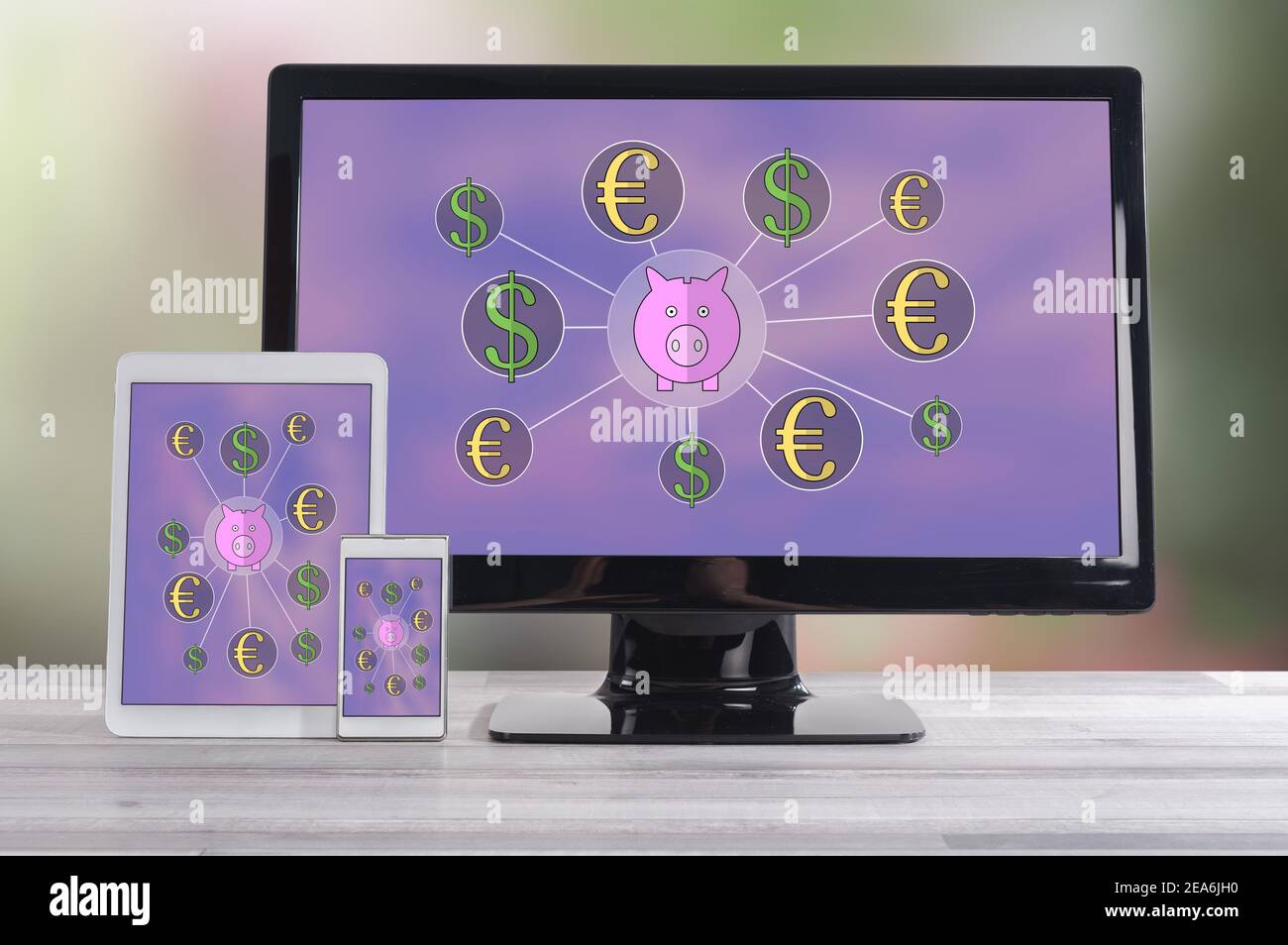 Money saving concept shown on different information technology devices Stock Photo