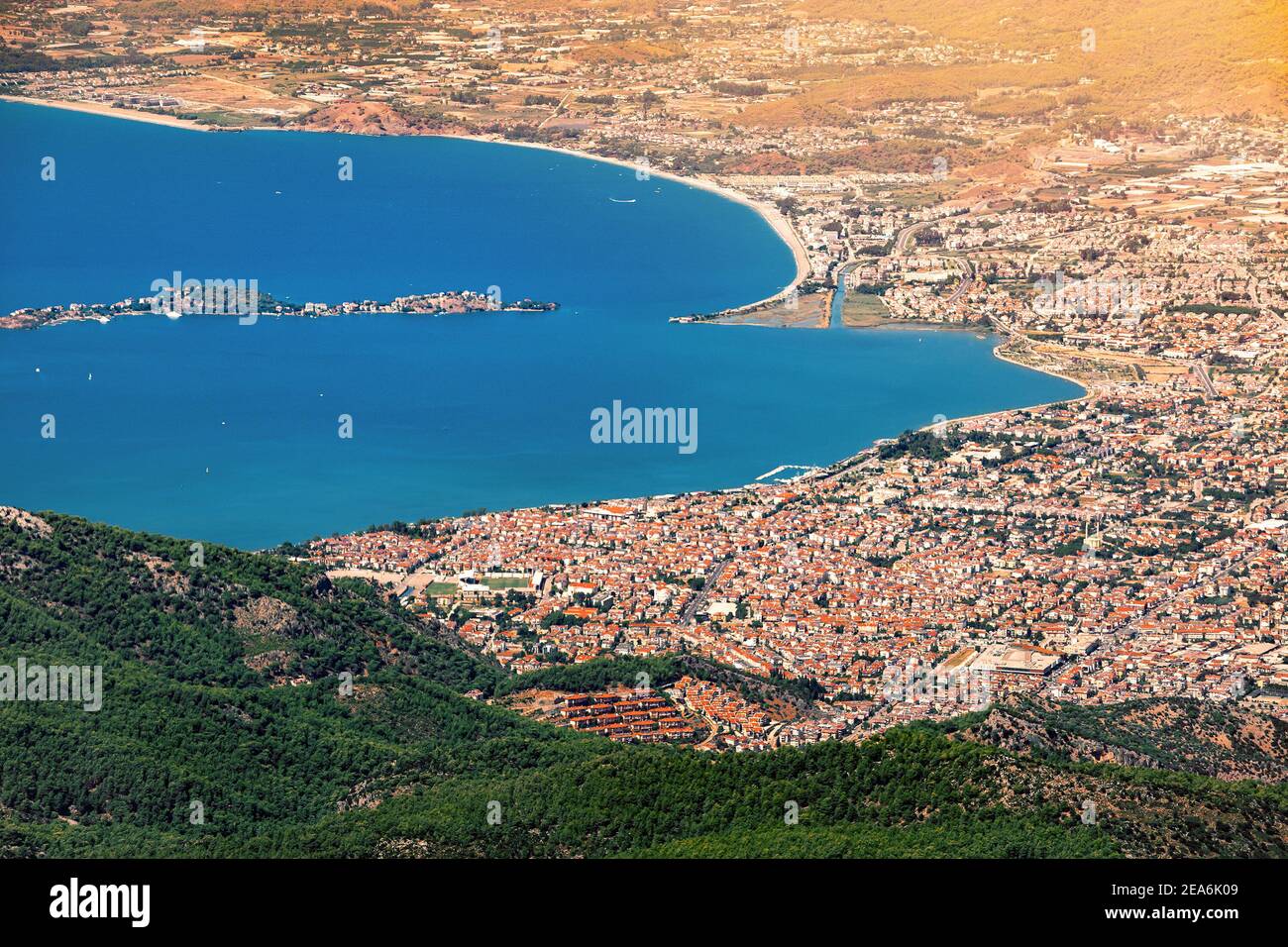 Aerial distant view of Fethiye resort town with red roofs and gocek bay coastline. Mediterranean cities concept Stock Photo