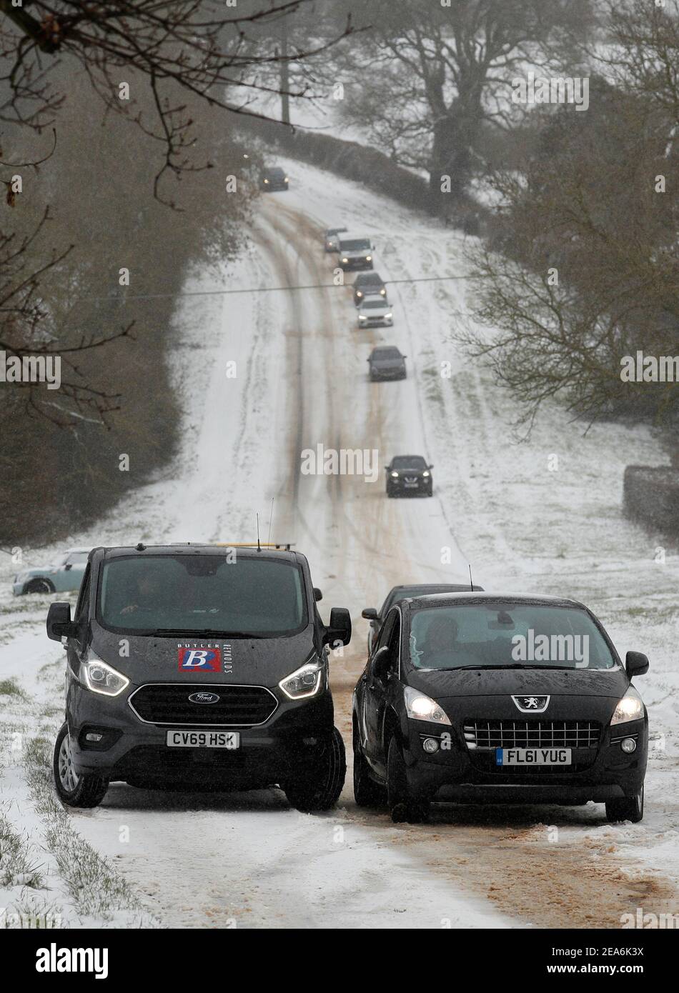 Uppingham, Rutland, UK. 8th February 2021. UK weather. Stranded motorists sit on a snow and ice covered hill. Credit Darren Staples/Alamy Live News. Stock Photo