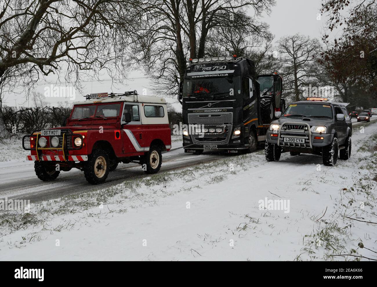 Uppingham, Rutland, UK. 8th February 2021. UK weather. A driver from Leicestershire and Rutland 4x4 Response pulls a stranded lorry up a snow and ice covered hill. Credit Darren Staples/Alamy Live News. Stock Photo