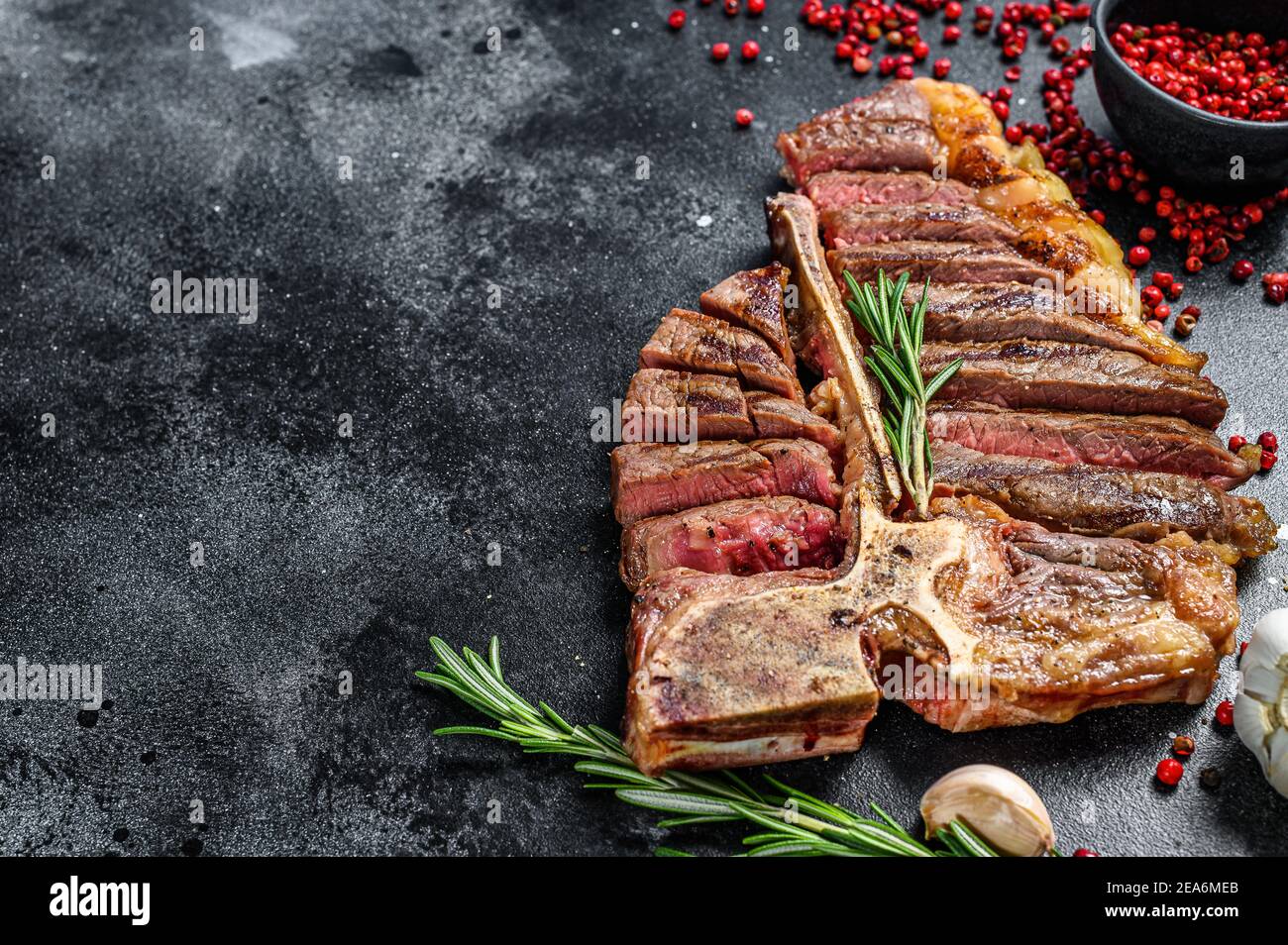 sliced-grilled-t-bone-steak-cooked-tbone-beef-meat-black-background