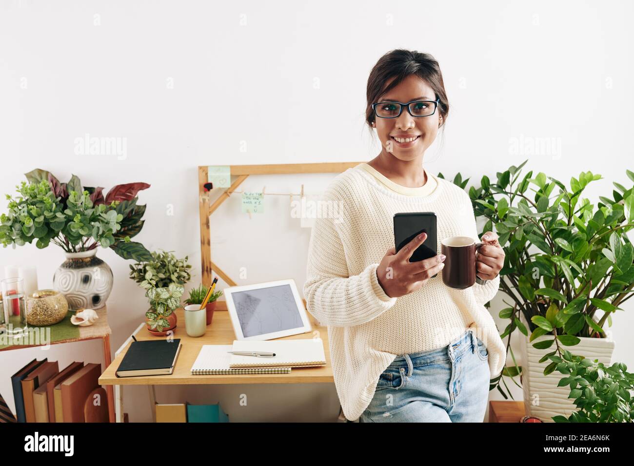 Pretty smiling fashionn designer Stock Photo