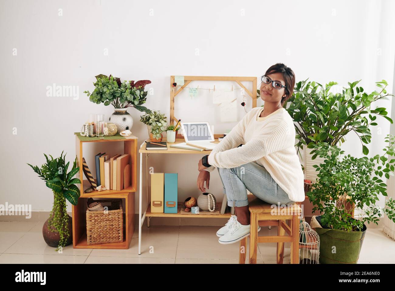 Young woman studying at home Stock Photo