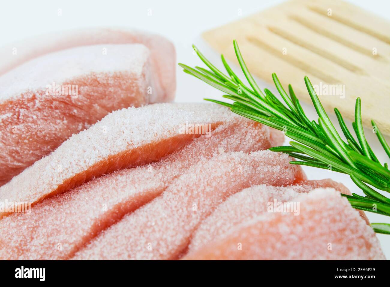 Frozen Poultry and Rosemary close up Stock Photo