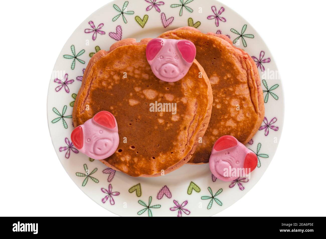 Percy Pig pancakes from M&S on plate with Percy Pig sweets ready for St Valentines day set on white background Stock Photo